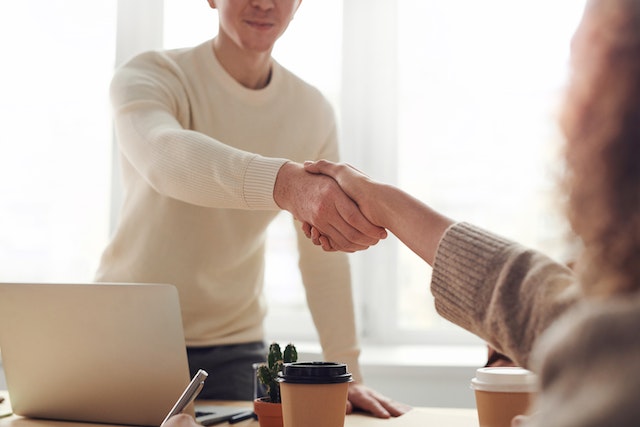 two people sharing a handshake