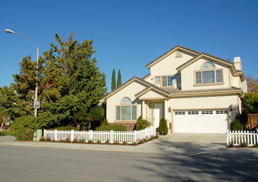 large-home-with-trees-and-triangle-roof